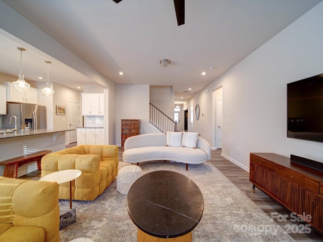 living room with sink and dark hardwood / wood-style flooring