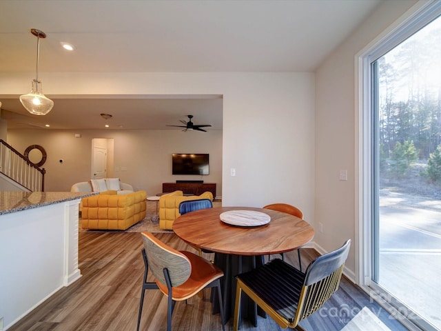 dining room featuring hardwood / wood-style flooring and ceiling fan