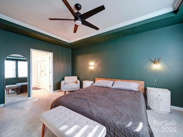 bedroom with ornamental molding, carpet flooring, ensuite bathroom, and ceiling fan