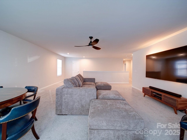 living room featuring carpet floors and ceiling fan