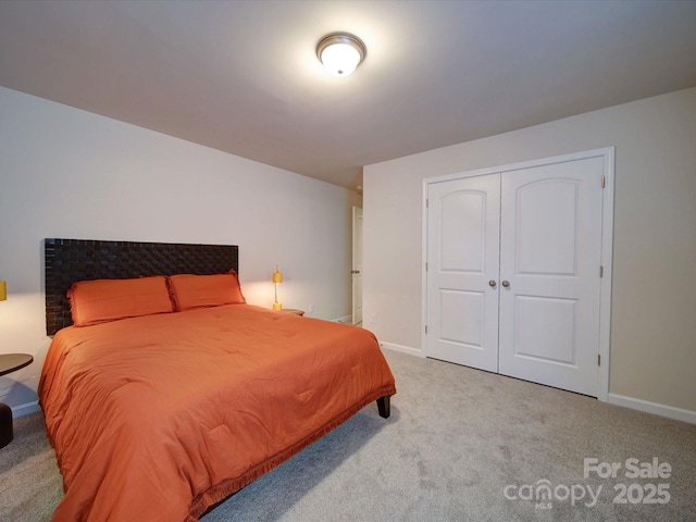 carpeted bedroom featuring a closet