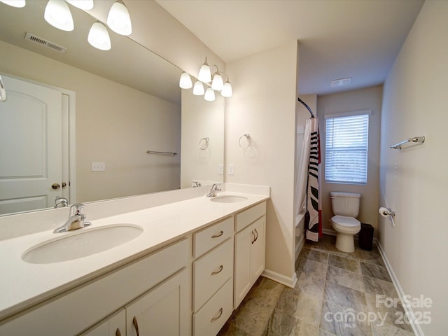 bathroom featuring vanity, a shower with curtain, and toilet