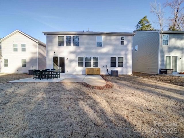 back of house with a patio and central air condition unit