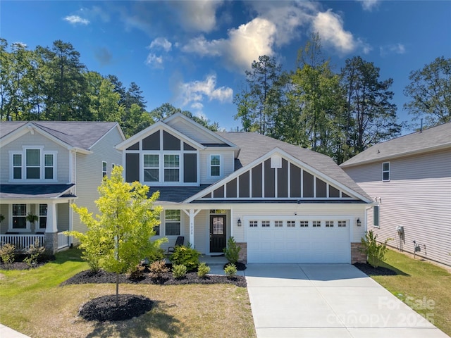 5028 Colline Ct, Charlotte, NC 28216 - craftsman-style house with covered porch, a garage, concrete driveway, and a front yard