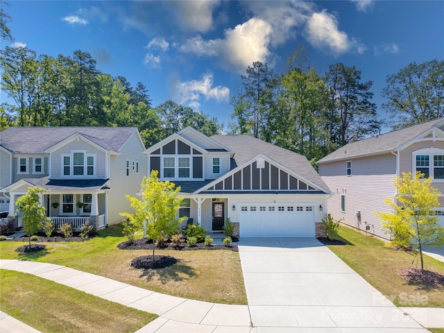 5028 Colline Ct, Charlotte, NC 28216 - craftsman inspired home featuring a porch, a garage, driveway, and a front yard