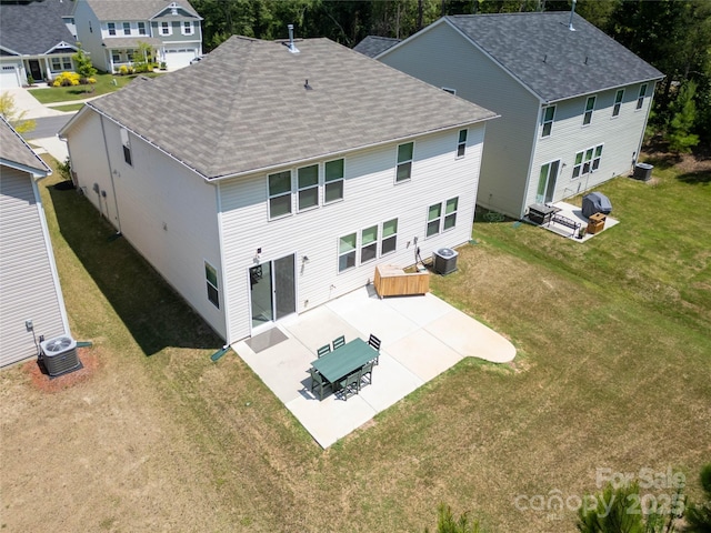 5028 Colline Ct, Charlotte, NC 28216 - back of house with a patio, a shingled roof, and a lawn