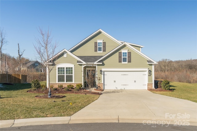 view of front of property with a garage and a front lawn