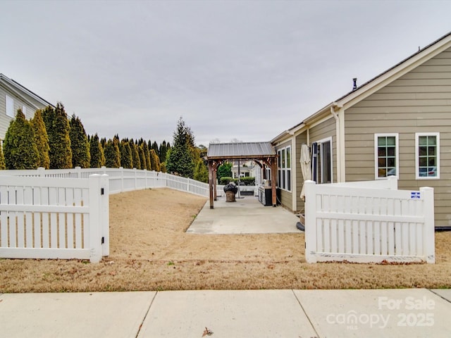 exterior space featuring a gazebo and a patio