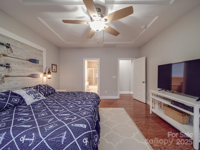 bedroom featuring hardwood / wood-style flooring, ceiling fan, a raised ceiling, and wood walls