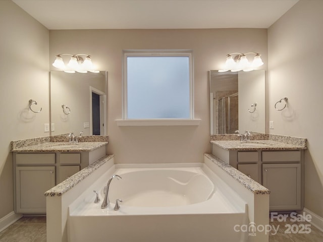 bathroom with vanity, tile patterned floors, and plus walk in shower