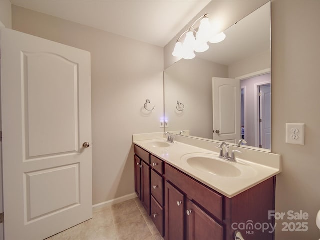 bathroom with tile patterned flooring and vanity