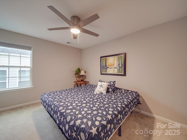 carpeted bedroom with ceiling fan