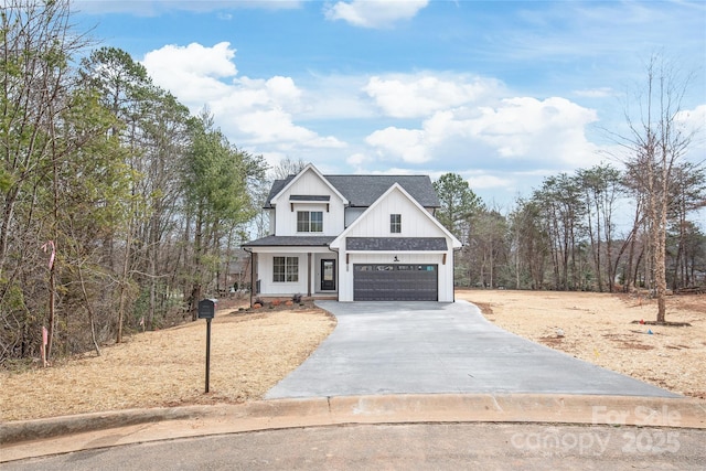 modern farmhouse style home with concrete driveway, a garage, board and batten siding, and a shingled roof