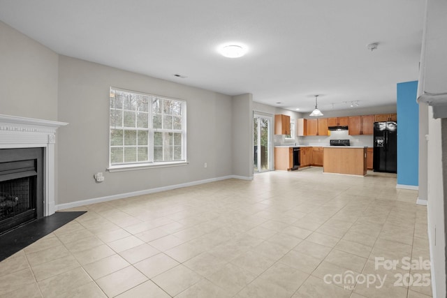 unfurnished living room featuring light tile patterned floors