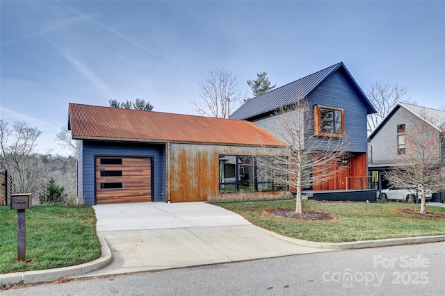 view of front of house with a garage and a front yard