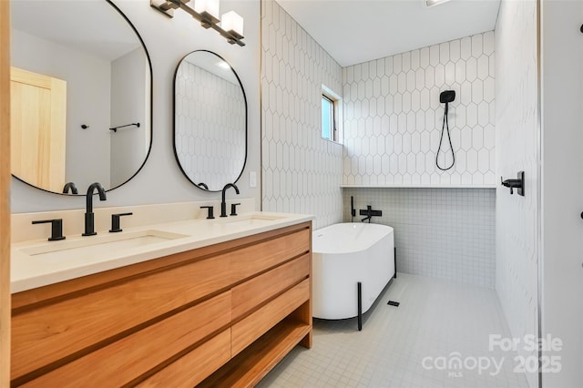 bathroom with tile walls, vanity, tile patterned floors, and shower with separate bathtub