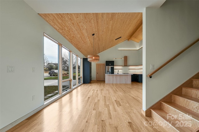 living room with wood ceiling, high vaulted ceiling, and light hardwood / wood-style flooring