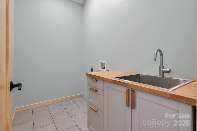 bathroom featuring tile patterned flooring and sink