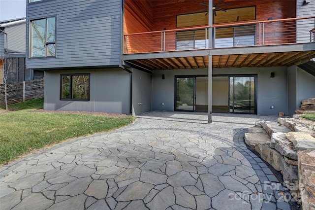 back of house featuring a yard, a patio, and ceiling fan