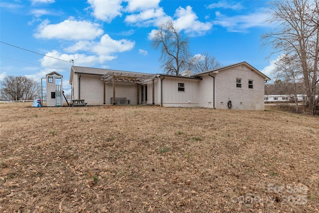 back of property with a yard