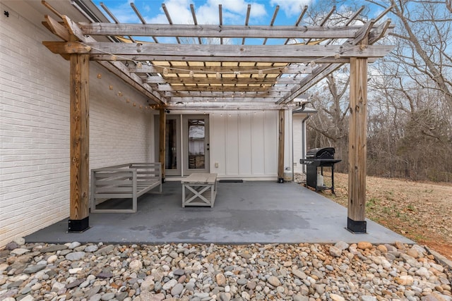 view of patio with grilling area and a pergola