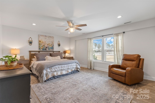 bedroom featuring hardwood / wood-style flooring and ceiling fan