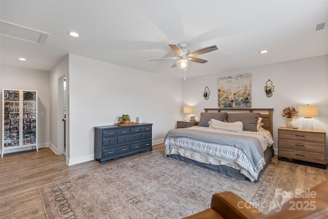 bedroom featuring light hardwood / wood-style flooring and ceiling fan