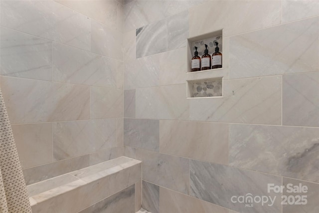 interior space with tiled shower