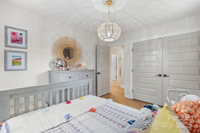 bedroom featuring hardwood / wood-style flooring and a closet