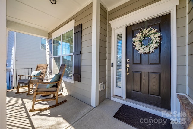 doorway to property featuring covered porch