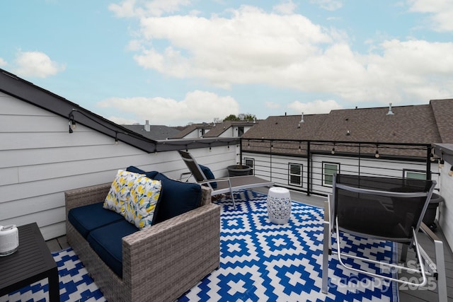 view of patio featuring a balcony