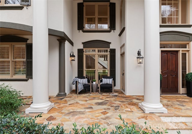 doorway to property with stucco siding