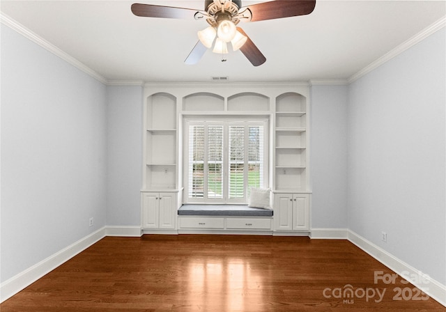 unfurnished room featuring dark wood finished floors, visible vents, baseboards, and ceiling fan