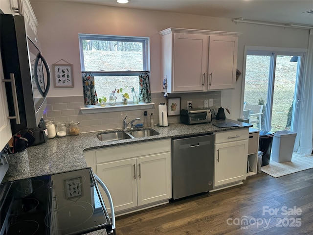 kitchen featuring sink, dark wood-type flooring, white cabinetry, stone countertops, and stainless steel dishwasher