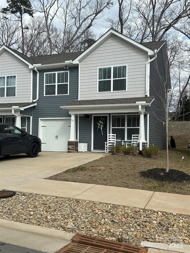 view of front of property featuring a porch and a garage