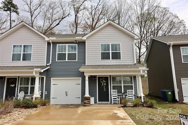 14 Malcolm Ct, Candler, NC 28715 - view of front of house with concrete driveway, roof with shingles, and covered porch