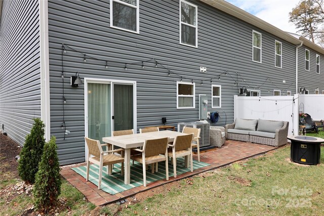 14 Malcolm Ct, Candler, NC 28715 - rear view of property featuring an outdoor living space, a lawn, fence, and a patio