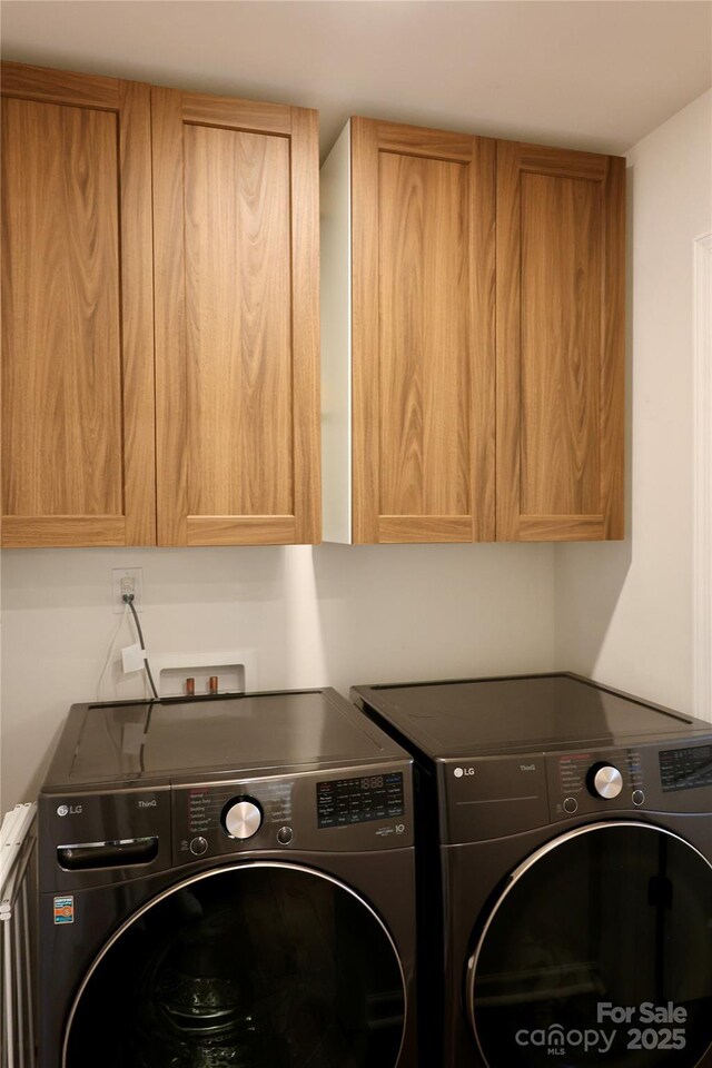 14 Malcolm Ct, Candler, NC 28715 - laundry area featuring cabinet space and independent washer and dryer