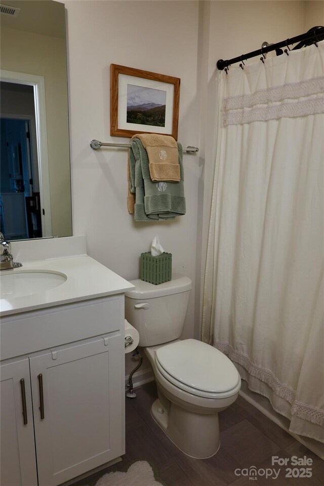 14 Malcolm Ct, Candler, NC 28715 - bathroom featuring a shower with curtain, vanity, visible vents, and toilet