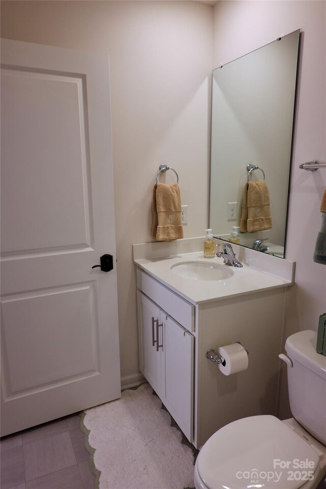 14 Malcolm Ct, Candler, NC 28715 - half bathroom featuring vanity and toilet