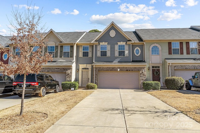 townhome / multi-family property featuring a garage