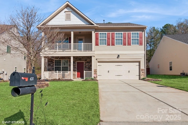 view of front of house featuring a porch, stone siding, and a front lawn