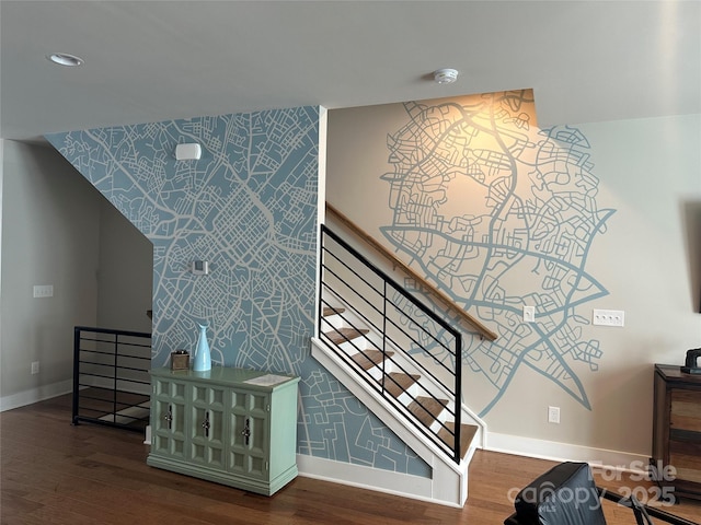 staircase with hardwood / wood-style floors