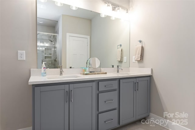 bathroom with a shower with door and vanity