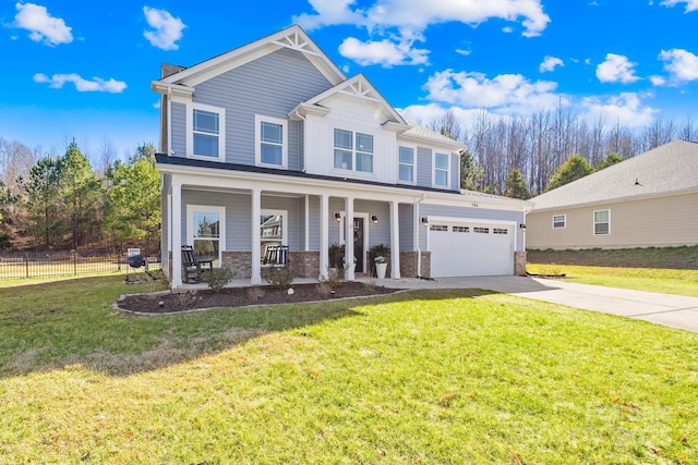 view of front facade with a porch, an attached garage, fence, driveway, and a front lawn