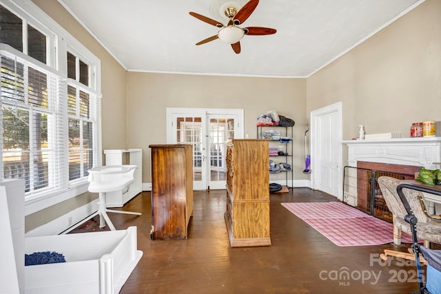 home office featuring crown molding, a healthy amount of sunlight, dark hardwood / wood-style flooring, and french doors