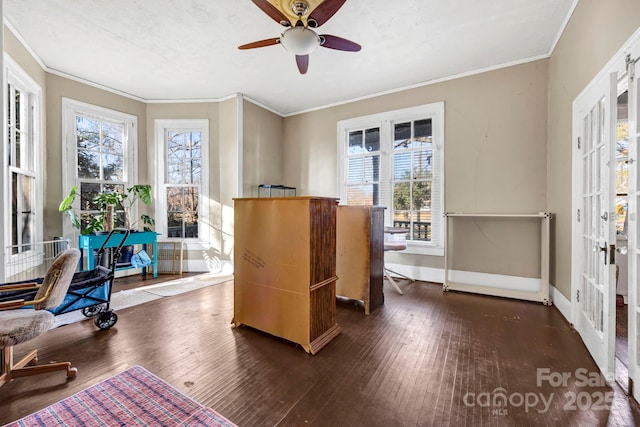 home office with dark hardwood / wood-style flooring, crown molding, and ceiling fan