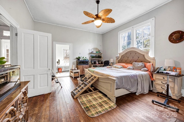 bedroom featuring crown molding, ceiling fan, and dark hardwood / wood-style flooring