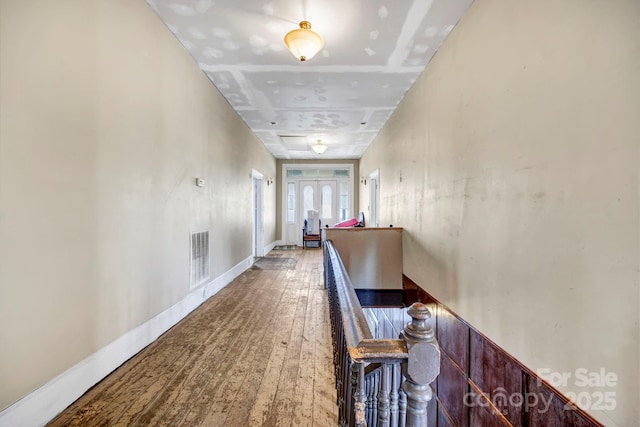 corridor featuring wood-type flooring