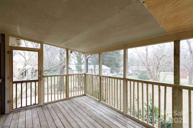 unfurnished sunroom featuring a wealth of natural light